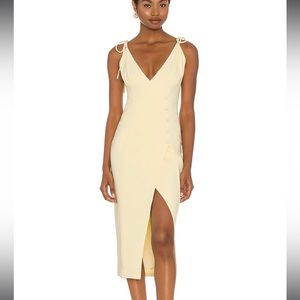 Light yellow, low cut midi dress. Perfect for a wedding!